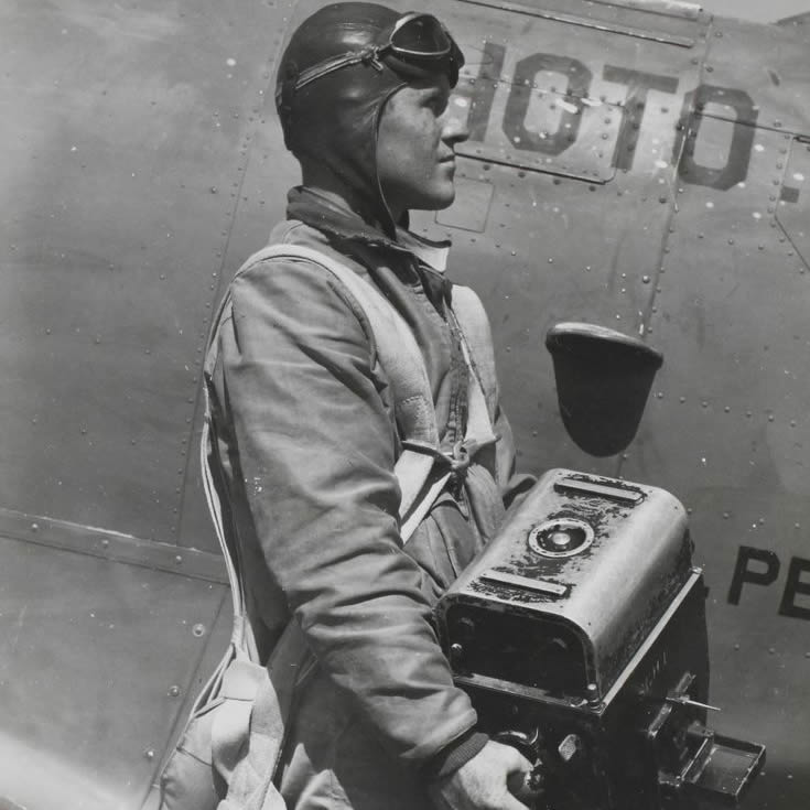 Granda poses wearing his arial photography gear_
