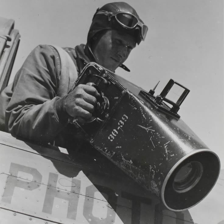 Grandpa demonstrates how he would take pictures from the aircraft_